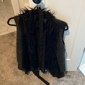 Black fur vest with feather detail